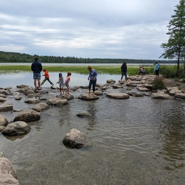 family walking across the mississippi river