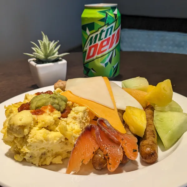 Egg, salmon, sausage, cheese, fresh fruit, mountain dew.