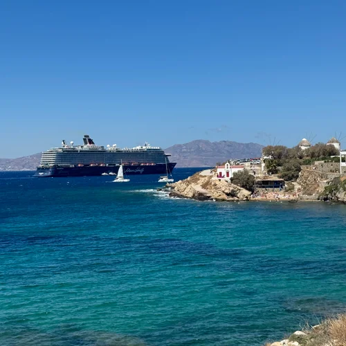 Cruise ship and sailboats